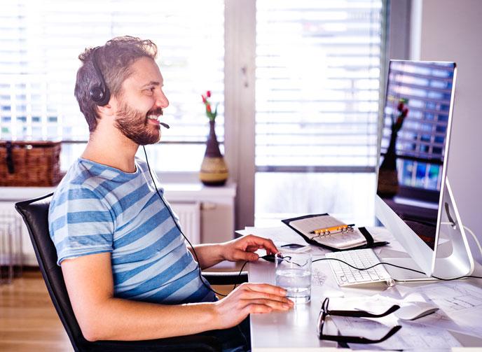 Man with headset working from home